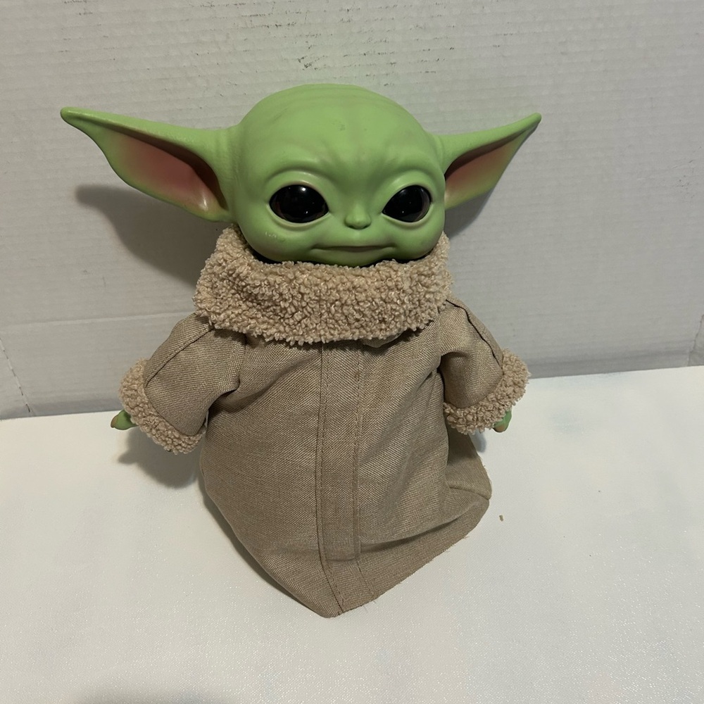 Green and Tan Kids Toy Figure